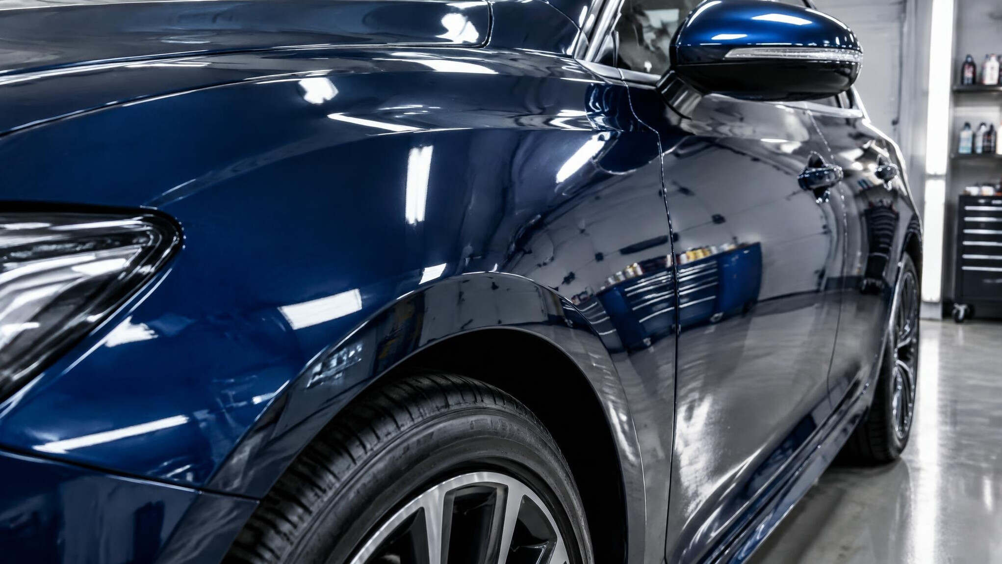 Glossy dark car paint with reflections after polishing