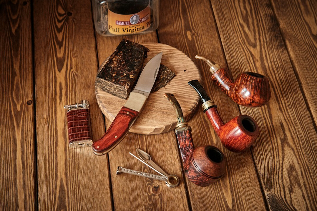 Hand tools and polishing supplies on a wooden table